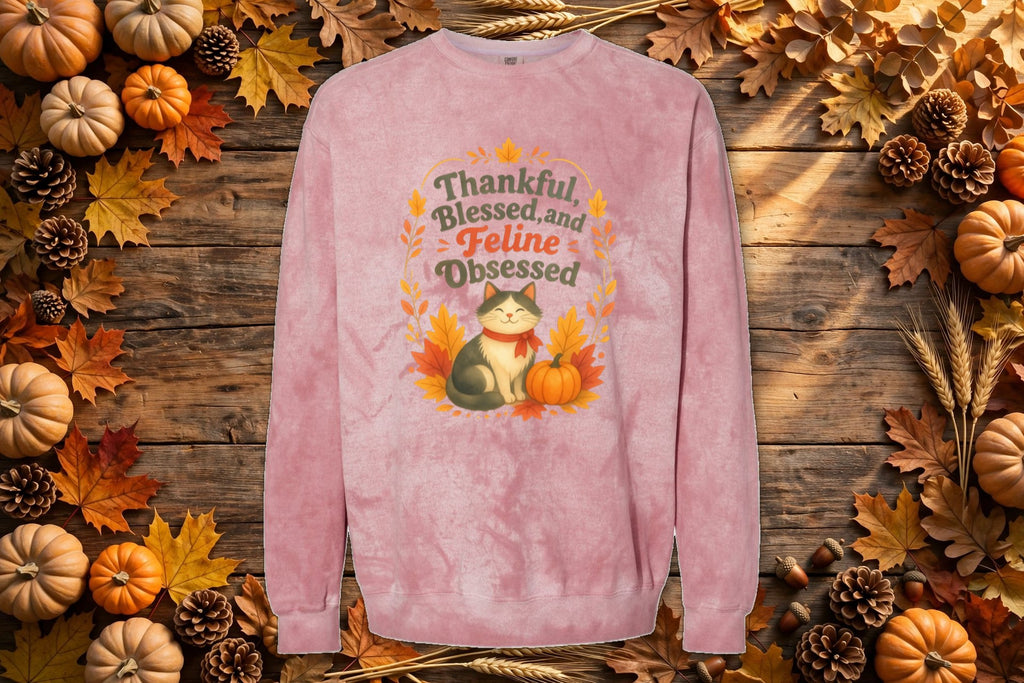 Thankful, Blessed and Feline Obsessed tie-dye crewneck styled on an autumn flat lay