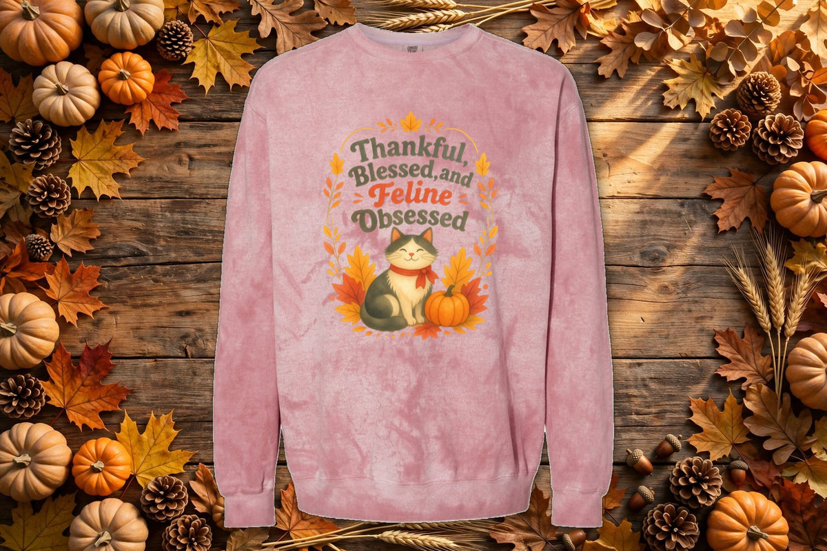 Thankful, Blessed and Feline Obsessed tie-dye crewneck styled on an autumn flat lay