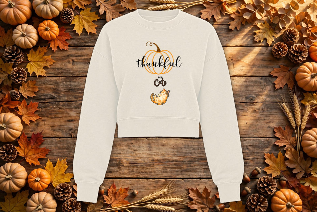 Thankful for Cats cropped crewneck styled on an autumn flat lay